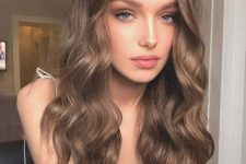long and volumetric light brown hair with volume and waves is a timeless solution if you don’t want too bold shades