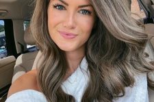 long and wavy mousy brown hair with much volume is always a good and very subtle idea to rock