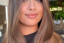 long light brown hair with blonde babylights and a bit of volume is a lovely idea for a modern and fresh look