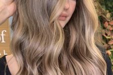 long light brown hair with blonde balayage, waves and volume is a lovely idea to rock right now