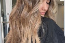 long light brown hair with caramel balayage, waves and volume, is a lovely and chic idea to rock right now