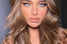 long light brown volumetric hair is a fantastic idea, add a shiny finish to look more adorable