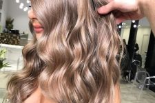 long light brown wavy hair with some volume is a chic and catchy idea to rock, it looks fab