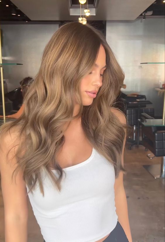 long mousy brown hair with waves and volume is always a cool idea for those who loves lighter shades