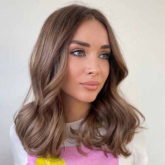 medium-length light brown hair is a lovely solution, add waves and volume and you will look adorable