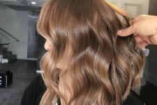 medium-length light brown hir with face-framing layers, waves and volume is a chic and stylish idea