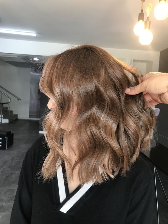 medium-length light brown hir with face-framing layers, waves and volume is a chic and stylish idea