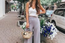 slate grey cropped wideleg pants, a white silk top with lace, nude heels and a wicker bag for a casual summer wedding