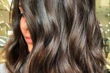 09 a beautiful and luxurious dark brunette medium-length wavy haircut with highlights is a lovely idea