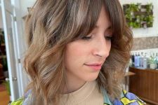14 a bronde ombre long wavy bob with curtain fringe and highlights is a cool hairstyle with minimum effort