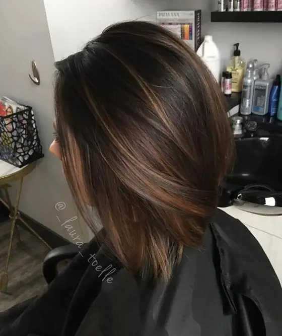 a chocolate brown straight bob with light caramel balayage to give it a dimension