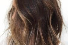 26 a shaggy brunette bob with face-framing bronde balayage to highlight the face