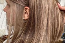 27 light brunette medium-length hair with subtle honey blonde highlights is a lovely and natural-looking idea