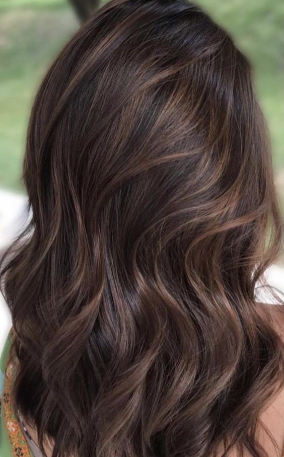 long and luxurious dark brunette hair with subtle caramel balayage is a chic and very beautiful solution