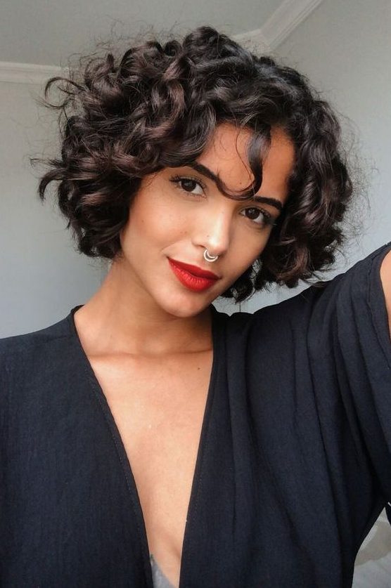 a dark brown and chestnut naturally curly chin length bob is a fantastic idea that wows