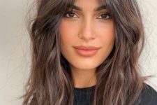 40 long shaggy dark chestnut hair with central parting and waves is a cool idea for an effortlessly chic look