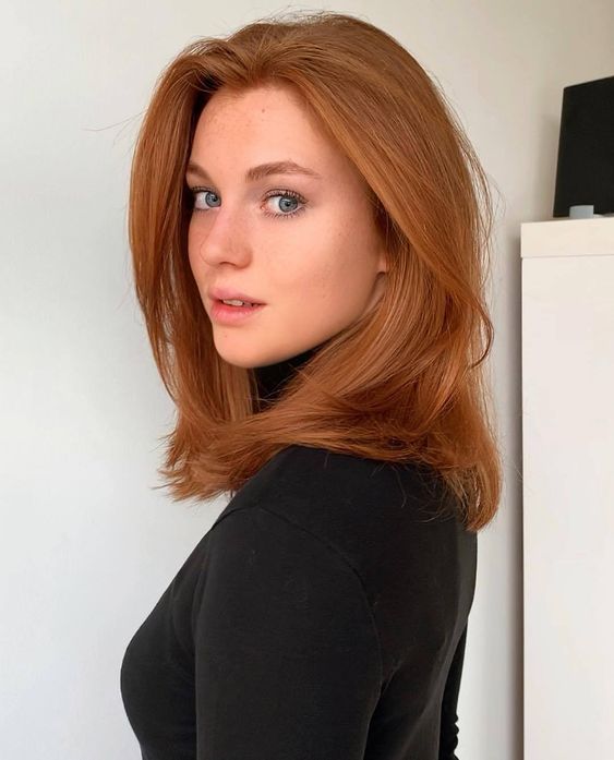 Beautiful medium length ginger hair with a lot of volume is a timeless idea that looks amazing