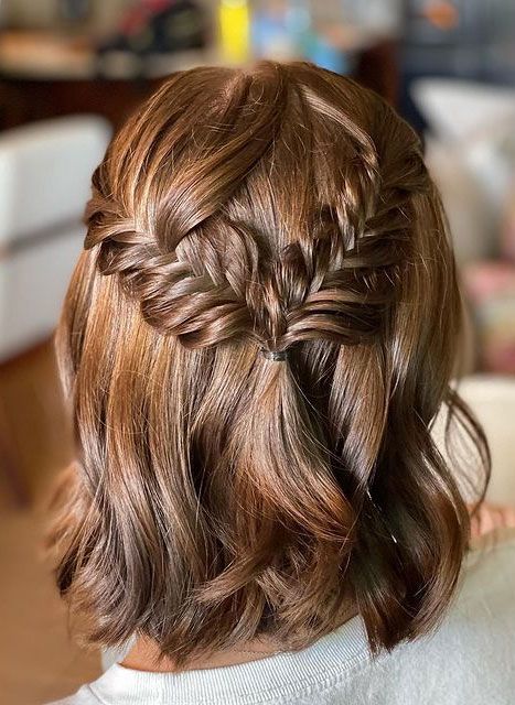 a beautiful medium half updo with a fishtail braid halo and waves down is a cool solution for some party