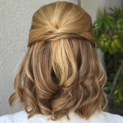 a beautiful medium half updo with twists and waves down is a chic idea for some party or special occasion