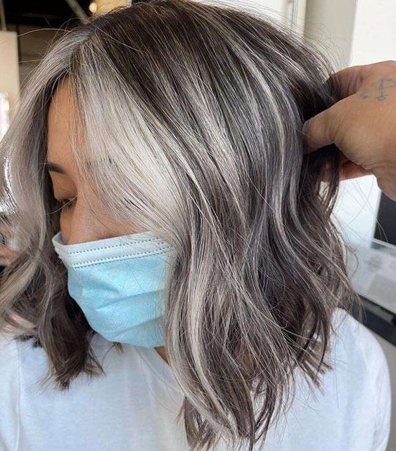 a cool brown long bob with grey highlights and a money piece is a very eye-catchy and lovely solution