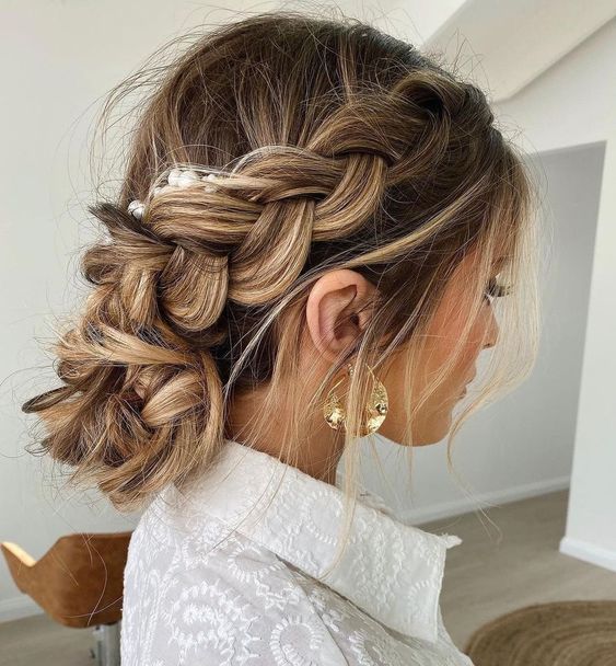 a cool loose braid on the side of the head, with a braided low bun and some pearl pins for a lovely Christmas look