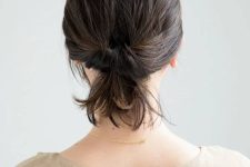 a cool wrapped loop ponytail with a messy top is a cool take on a usual low ponytail