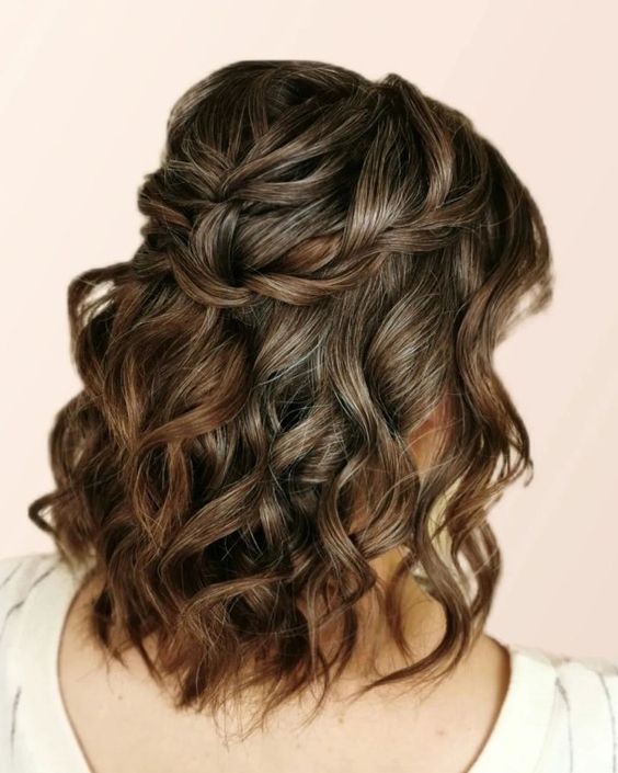 a dreamy medium half updo with braided elements and curls down is a lovely idea for a wedding