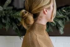 a fast and casual low bun hairstyle wih a bump on top and face-framing hair is a super cool and chic solution
