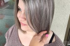a long brown bob with silver grey balayage and naturally sivler grey hair looks very stylish