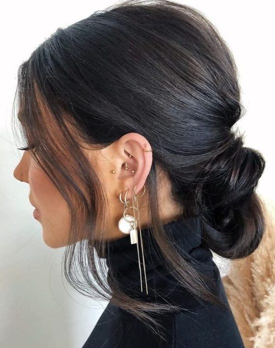 a low knot with a bump on top and some hair framing the face is a catchy and lovely idea for anyone