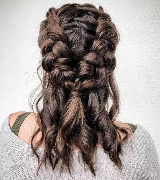 a medium half updo with chunky side braids and curls is a cool and catchy hairstyle idea if your hair isn't long