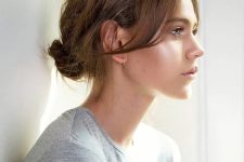 a messy low bun with a messy top is a cool idea you can rock every day