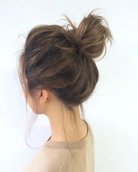 a messy top knot with a bump on top and down will help you keep your hair up and feel comfortable
