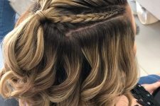 a pretty half updo with a large and two small braids on top an waves down is adorable