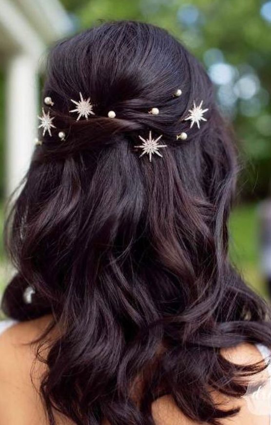 a pretty half updo with twists, waves down and pearls and stars is a fantastic idea to look dreamy at the party
