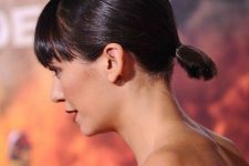 a sleek low ponytail with a sleek top and a classic fringe is a stylish idea for a bob