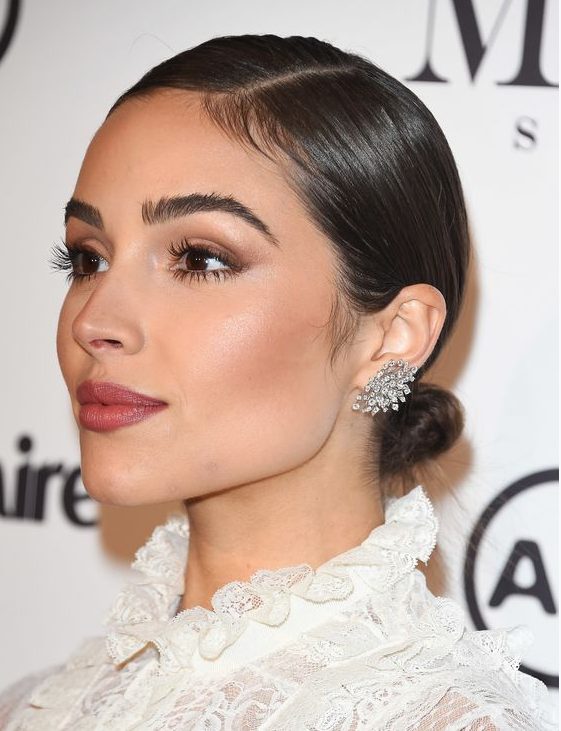 a small low bun with a super sleek top and side parting is a pretty formal and catchy idea that is extremely elegant