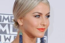 a small low bun with a zigzag part for extra flair yet with a natural smooth look