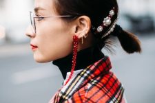 a small low ponytail with pearl barrettes is a cool solution for a modern and chic look