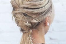 a twisted updo with a ponytail and a bump on top plus some hairpins is a creative for medium-length hair