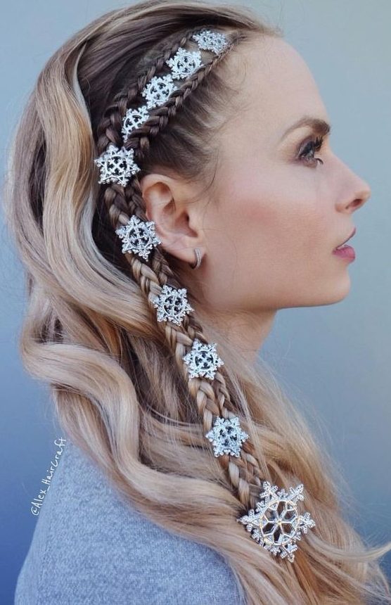 a unique half updo with two side braids and little snowflakes plus waves down is a cool idea for the holidays