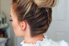 an elegant top knot with a bump and a braid on the back is a cute and fun option