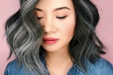 black shoulder=length hair with grey highlights and naturally grey hair, with waves and volume, looks adorable