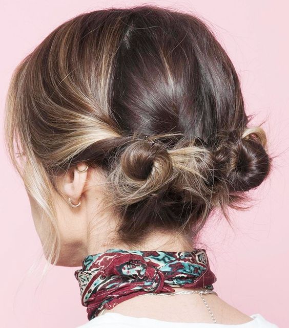 easy and messy little low buns and some hair down are a great and catchy hairstyle to rock with short hair