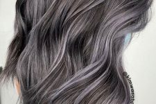 gorgeous long dark hair with grey highlights is a catchy idea to blend your naturally grey hair in