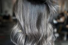 long and volumetric black hair with silver grey ombre and highlights plus waves is a lovely idea to rock