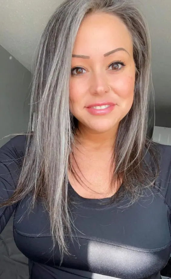 long brown hair with grey balayage and money piece to make naturally grey hair blend in in a beautiful way