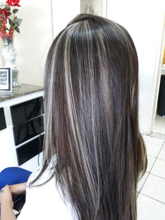 long dark brown hair with grey balayage tha blends with the natural greys looks very chic and catchy