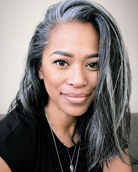 Medium length black hair with grey balayage and accents to naturally blend grey hair in