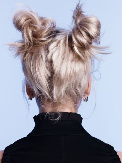 messy space buns on strawberry blonde hair, with mess around, is a cool updo for short hair